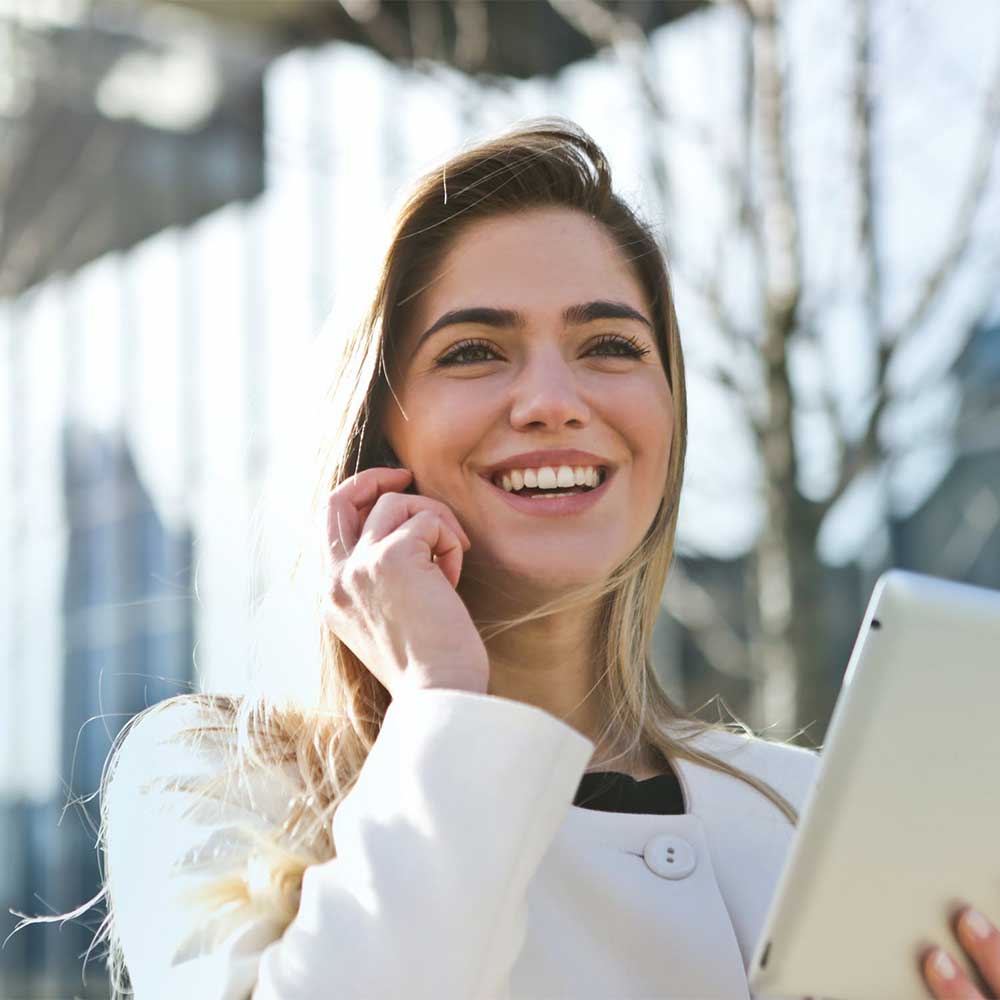 Woman talking on the phone while smiling